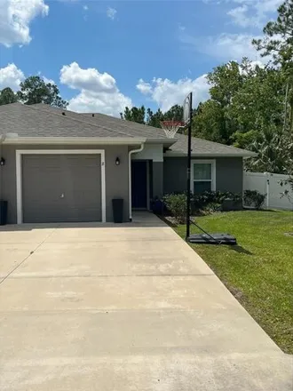 Rent this 3 bed house on 123 Brunswick Lane in Palm Coast, FL 32137