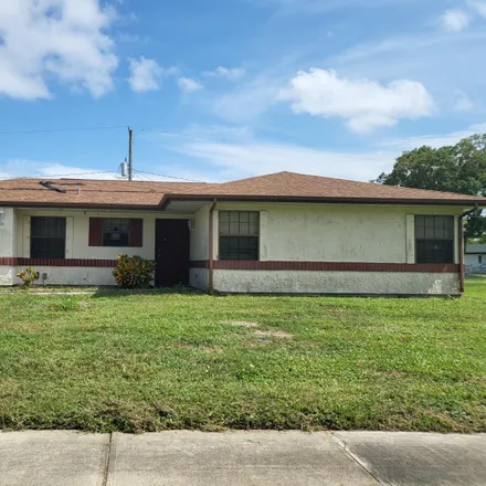 Buy this 3 bed house on 1055 Cadillac Drive Northeast in Palm Bay, FL 32905