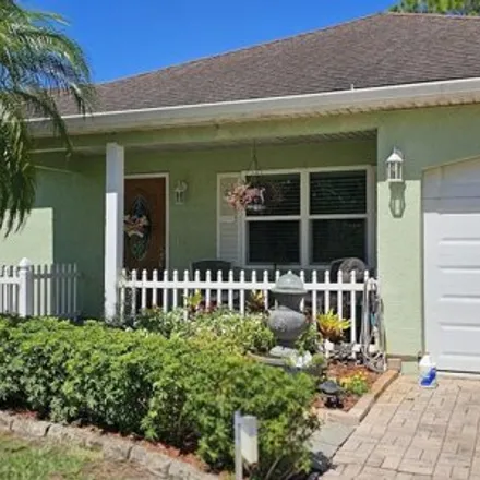 Buy this 3 bed house on 449 Northeast Midvale Street in Port Saint Lucie, FL 34983