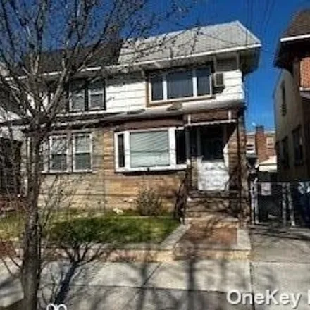 Buy this 3 bed house on 52-77 70th Street in New York, NY 11378