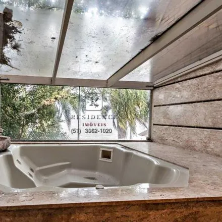 Rent this 4 bed house on Avenida Coronel Marcos in Pedra Redonda, Porto Alegre - RS