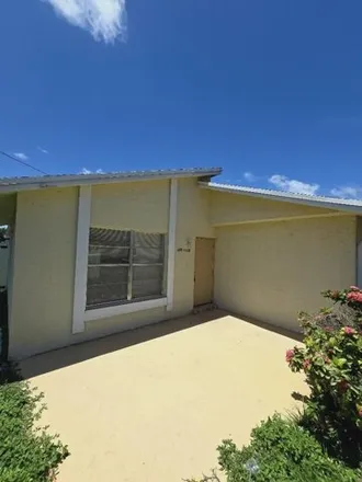 Rent this 2 bed house on 3226 49th Ln S Unit 3226 in Lake Worth, Florida