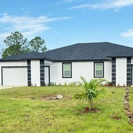 Rent this 3 bed house on 528 Bell Boulevard in Lehigh Acres, FL 33974