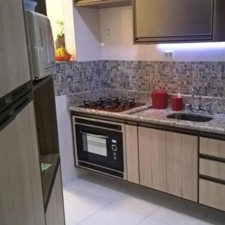 Buy this 3 bed apartment on Rua Helvino de Moraes in Cavarucanguera, Taubaté - SP