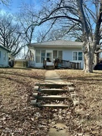 Buy this 3 bed house on 1233 North Cedar Street in Nevada, MO 64772