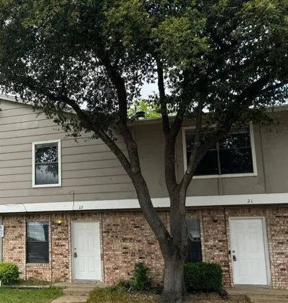 Rent this 2 bed townhouse on Manchester Drive in Garland, TX 75041