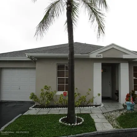 Buy this 2 bed house on 5925 Woodland Point Place in Tamarac, FL 33319