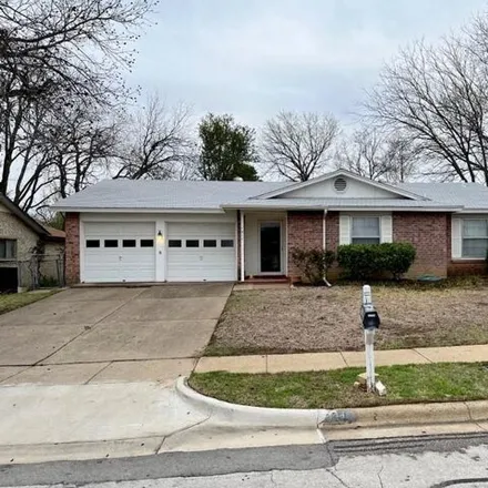 Rent this 3 bed house on 1863 Redwood Street in Arlington, TX 76014