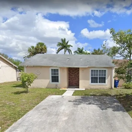Rent this 2 bed townhouse on 20405 Northwest 27th Court in Lake Lucerne, Miami Gardens