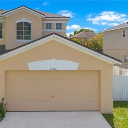 Buy this 4 bed house on 13238 Canna Lily Drive in Meadow Woods, Orange County