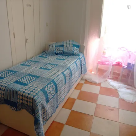 Rent this 3 bed room on Rua do Carrião in 1150-251 Lisbon, Portugal