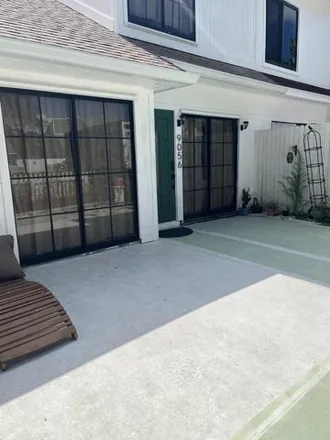Rent this 2 bed townhouse on 9056 Green Meadows Way in Palm Beach Gardens, Florida