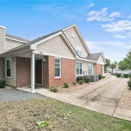 Buy this 3 bed townhouse on 709 Oak Mill Lane in Oyster Point, VA 23602