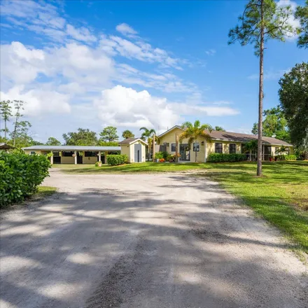 Buy this 4 bed house on 1615 E Road in Loxahatchee Groves, FL 33470