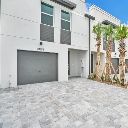 Rent this 3 bed loft on 570 Springdale Circle in Palm Springs, FL 33461