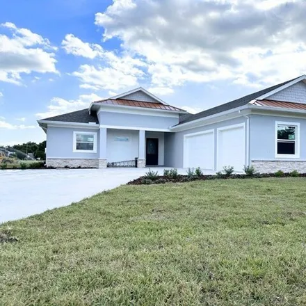 Buy this 4 bed house on Cypresswood Golf & Country Club in 1099 Clubhouse Road, Winter Haven