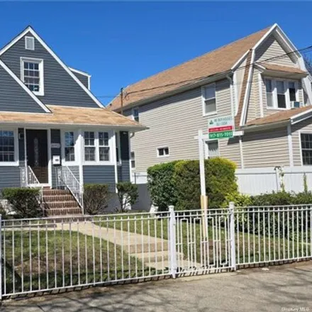 Buy this 4 bed house on 169-11 140th Avenue in New York, NY 11434