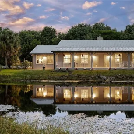 Buy this 4 bed house on 4300 Vinkemulder Rd in Coconut Creek, Florida