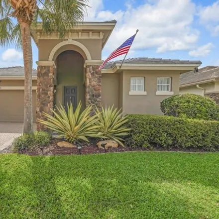 Buy this 4 bed house on 11210 Osprey Lake Ln in Palm Beach Gardens, Florida