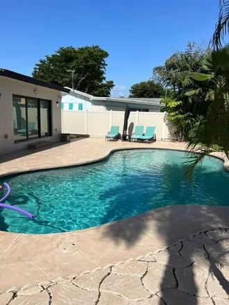 Buy this 3 bed house on 2551 Northeast 18th Street in Country Club Isles, Pompano Beach