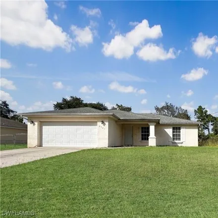 Rent this 3 bed house on 2570 50th Street West in Lehigh Acres, FL 33971