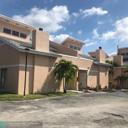Buy this 2 bed townhouse on 3969 Coral Springs Drive in Kensington Manor, Coral Springs