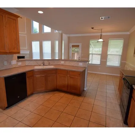 Rent this 4 bed apartment on 9701 Castle Pines Drive in Austin, TX 78717
