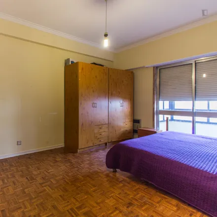 Rent this 4 bed room on Rua Professor Santos Lucas in 1500-613 Lisbon, Portugal