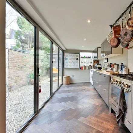 Rent this 2 bed townhouse on Newton Road in London, SW19 3PH