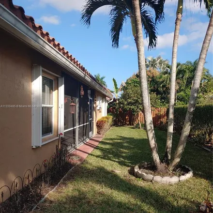 Rent this 4 bed apartment on 6489 Northwest 51st Court in Lauderhill, FL 33319