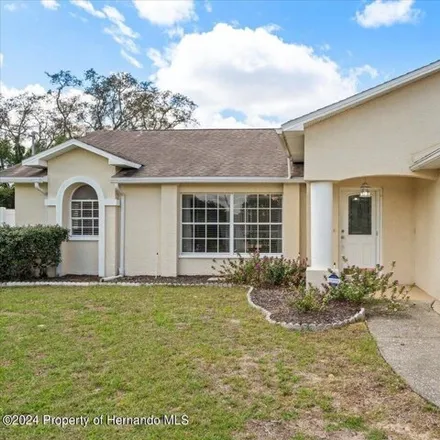Rent this 3 bed house on 1319 Bentley Avenue in Spring Hill, FL 34608