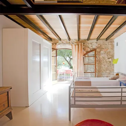 Rent this 2 bed townhouse on Carrer Sant Miquel in 07530 Sant Llorenç des Cardassar, Spain