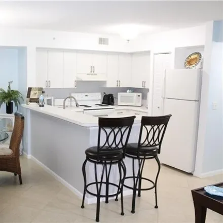 Rent this 3 bed condo on Wildwood Lakes Boulevard in Collier County, FL 34104