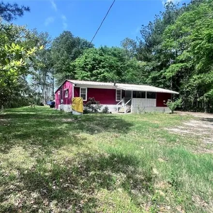 Buy this 2 bed house on 198 Magnolia Lane in Walker County, TX 77340
