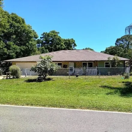 Buy this 4 bed house on 8064 Deland Avenue in Lakewood Park, FL 34951
