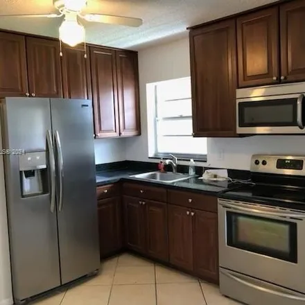Rent this 2 bed condo on Dunkin' in 751 East Commercial Boulevard, North Andrews Gardens