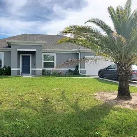 Buy this 4 bed house on 444 Southwest Hurtig Court in Port Saint Lucie, FL 34983