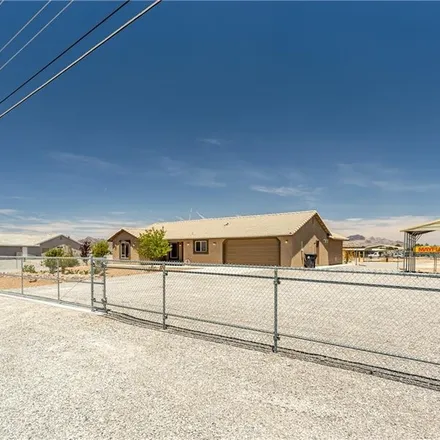 Buy this 4 bed house on 1770 West Charleston Park Avenue in Pahrump, NV 89048