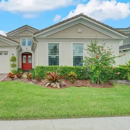 Buy this 5 bed house on 15238 Goldfinch Cir in Florida, 33470