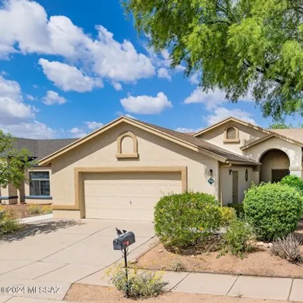 Buy this 4 bed house on 7959 North Supernova Drive in Pima County, AZ 85741