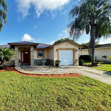 Buy this 4 bed house on 101 Dabou Loop in Belle Glade, FL 33430