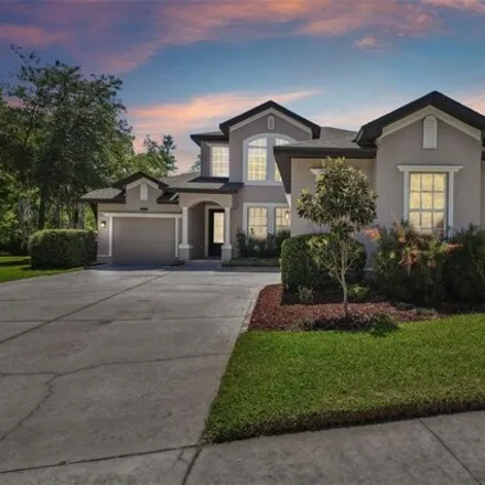 Buy this 5 bed house on 8844 Garden Party Drive in Pasco County, FL 34637