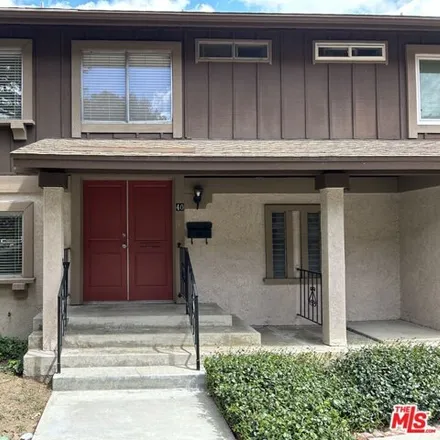 Rent this 4 bed townhouse on 6667 Archwood Street in Los Angeles, CA 91335