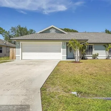 Buy this 4 bed house on 1057 Southwest Locke Avenue in Port Saint Lucie, FL 34953