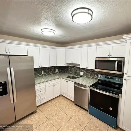 Rent this 3 bed condo on 2967 South Course Drive in Pompano Beach, FL 33069