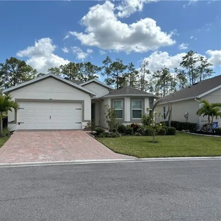 Rent this 3 bed house on Pigeon Plum Way in Herons Glen Golf and Country Club, Lee County