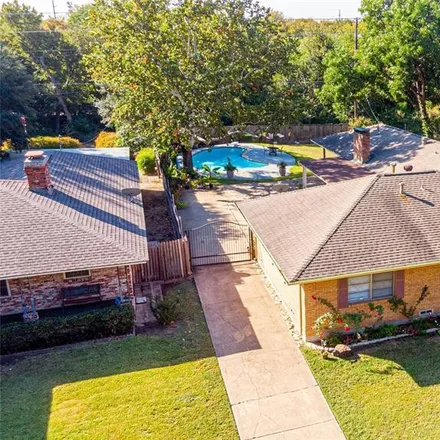 Buy this 4 bed house on 118 West Woodbury Drive in Garland, TX 75041