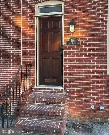 Rent this 4 bed townhouse on 104 South Poppleton Street in Baltimore, MD 21201