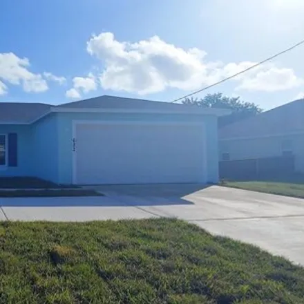 Rent this 3 bed house on 684 Southwest Paar Drive in Port Saint Lucie, FL 34953