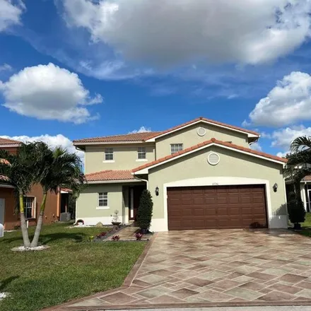 Rent this 4 bed house on 6698 Eagle Ridge Drive in Greenacres, FL 33413